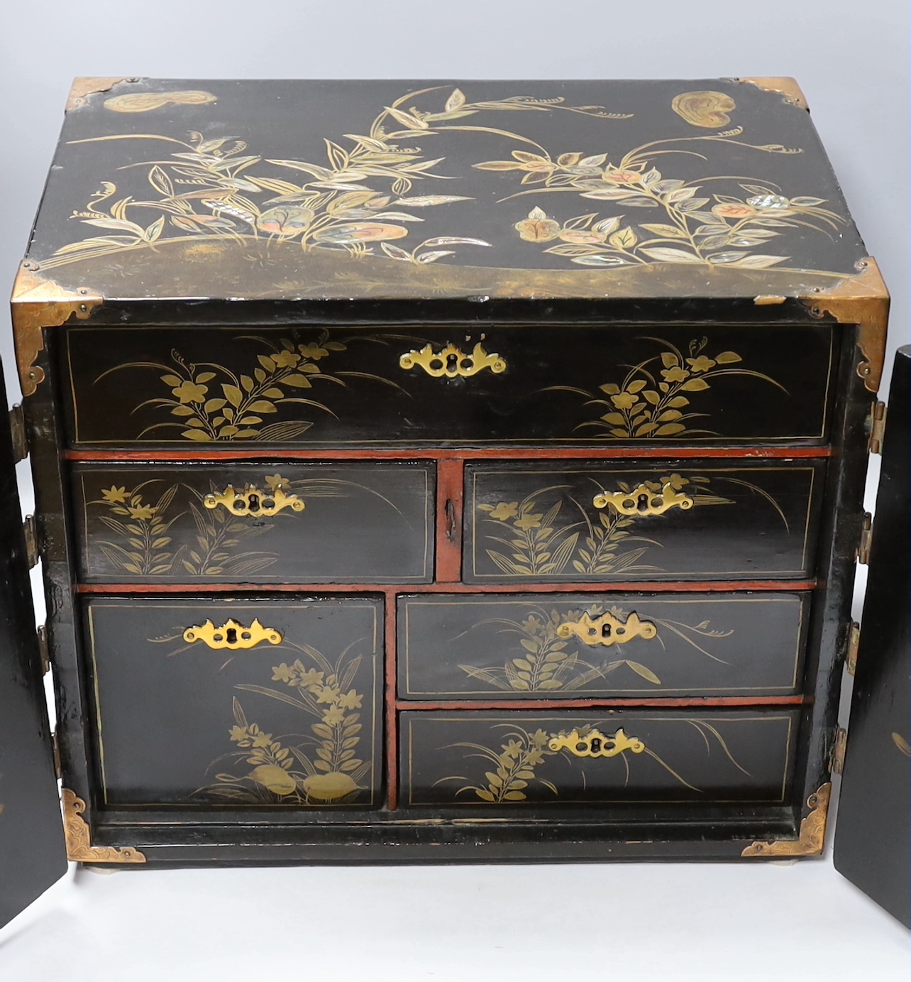 A 19th century Japanese lacquer table cabinet, 44cm wide